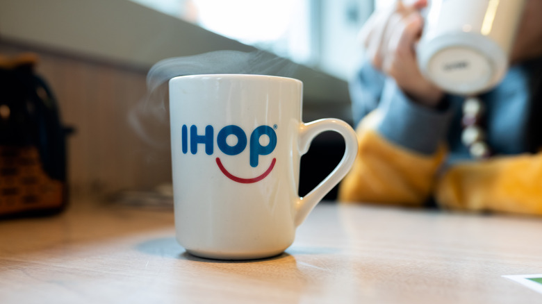IHOP coffee cup on table