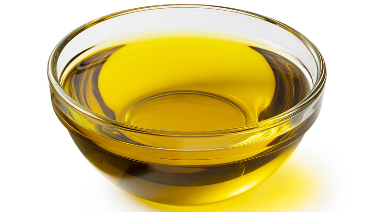 Glass bowl of olive oil