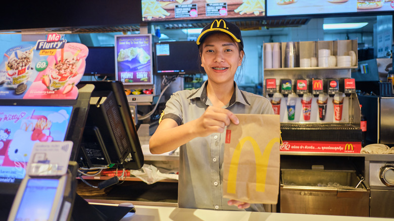 McDonald's staff member with order