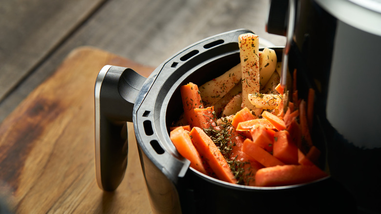 Air fryer with vegetables inside
