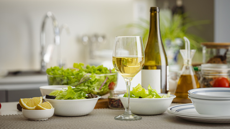 White wine and salads on a table