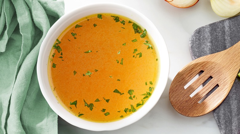 Chicken broth in white bowl