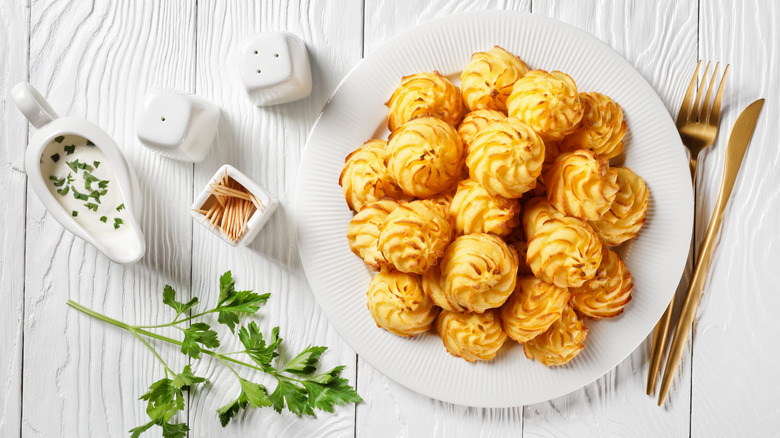 Duchess potatoes plated with sides