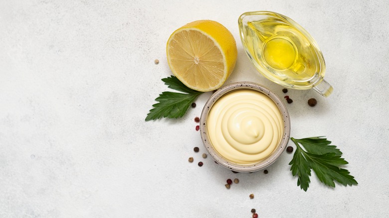 Bowl of mayonnaise and ingredients 