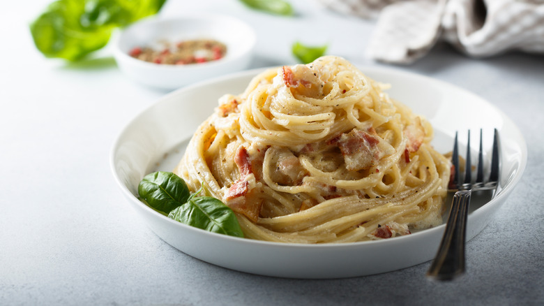 a plate of piled carbonara
