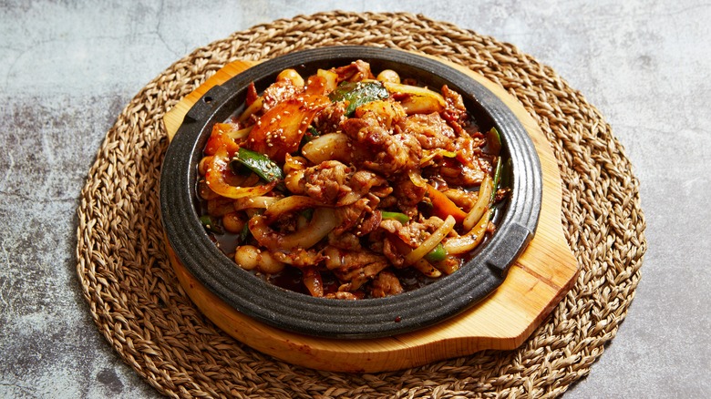 Pork stir fry in black dish