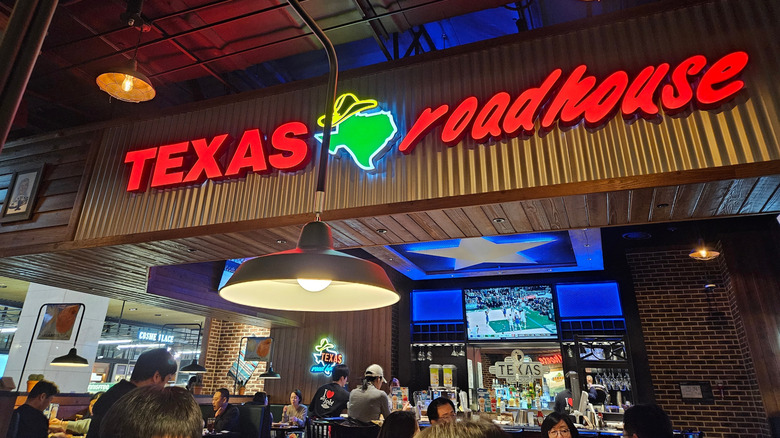 Texas Roadhouse sign above the bar and dining area at the restaurant