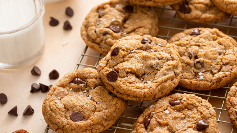 Chocolate chip cookies sprinkled with sea salt on cooling rack