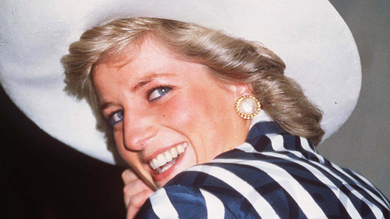 Princess Diana smiling in wide hat