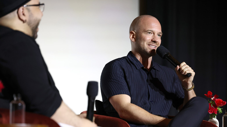 Sean Evans being interviewed at a panel event