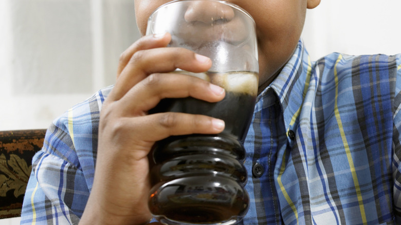 Kid drinking soda