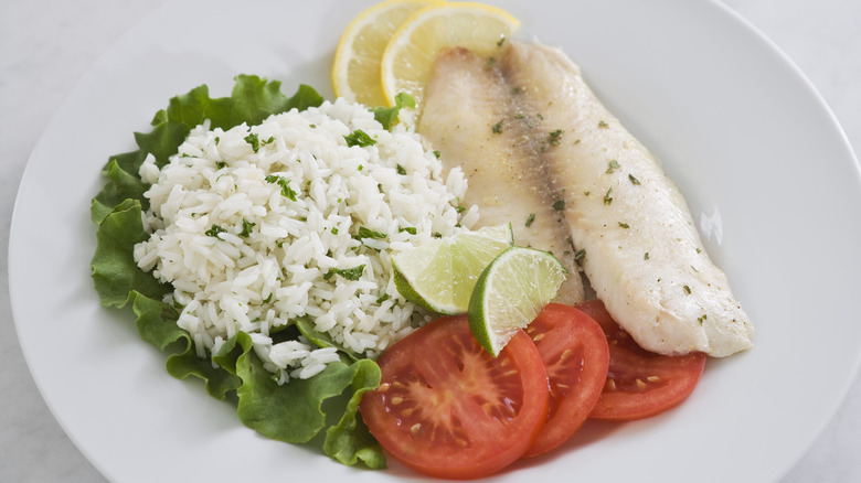 Tilapia with rice on a plate
