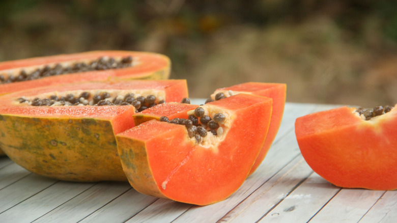 Fresh papaya on a wooden table