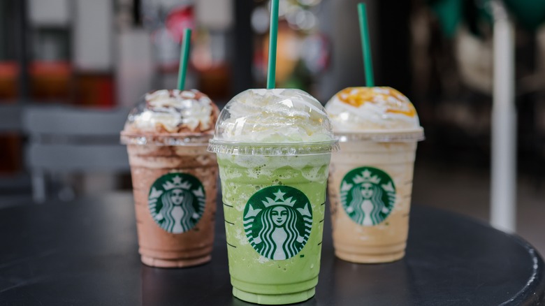 Three Starbucks Frappuccinos on a table 