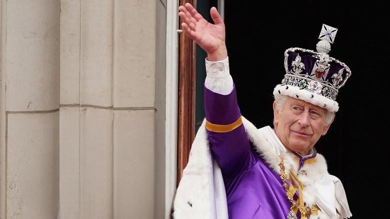 King Charles III wearing crowned jewels