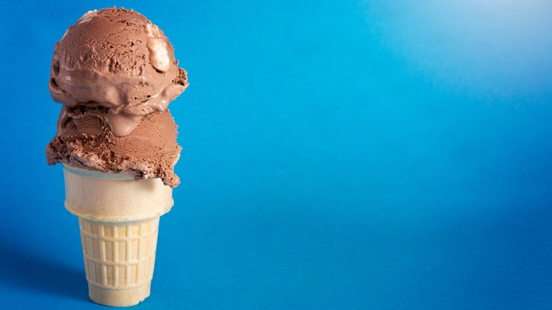 Rocky road ice cream on blue background