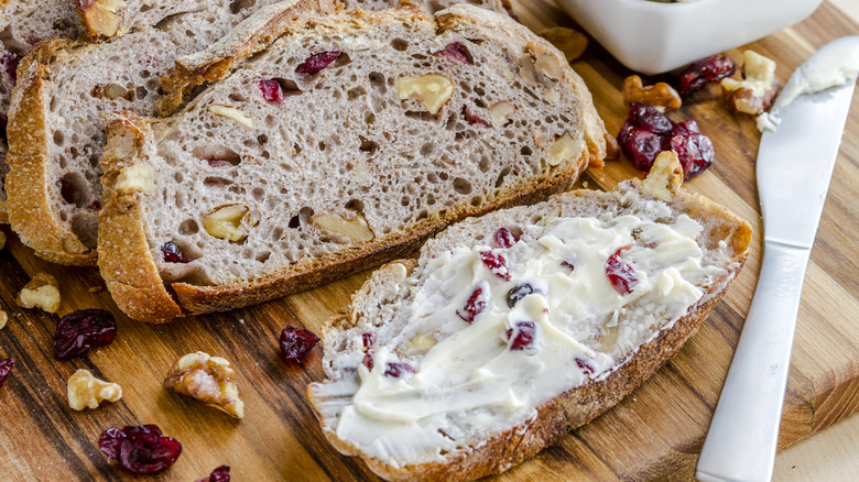 Butter with cranberries spread on bread