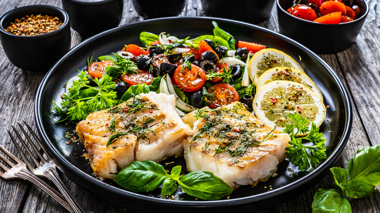 Pan-fried halibut with cherry tomatoes and greens