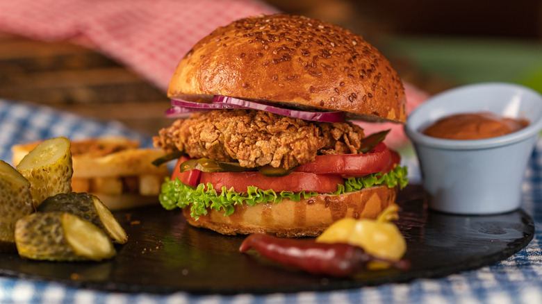 fried chicken sandwich on bun with toppings