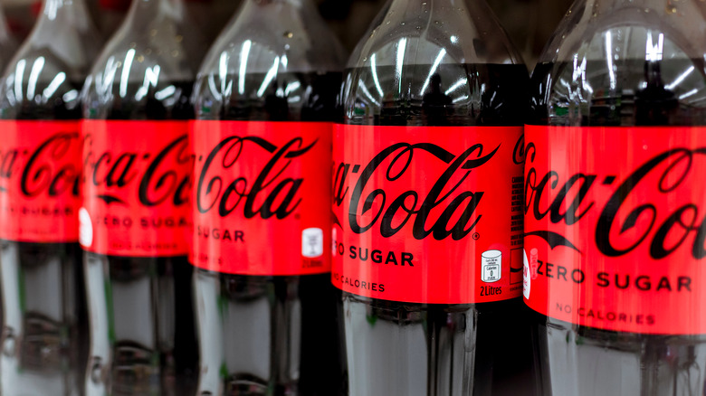 Coca-Cola Zero Sugar bottles lining shelf