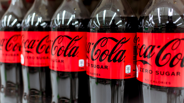 Coca-Cola Zero Sugar bottles lining shelf