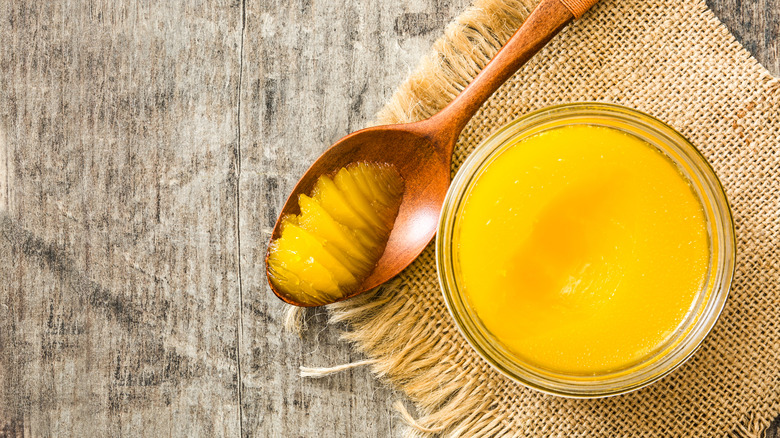 jar of clarified butter or ghee with spoonful