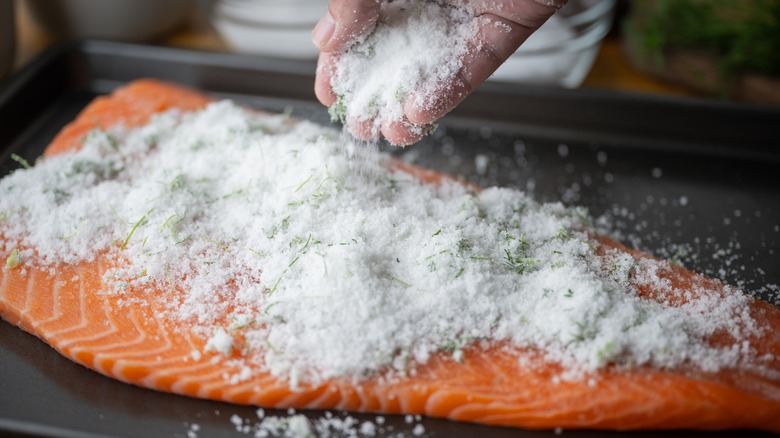 salmon being brined to make gravlax
