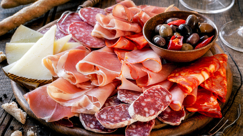 Meat and cheese board with olives
