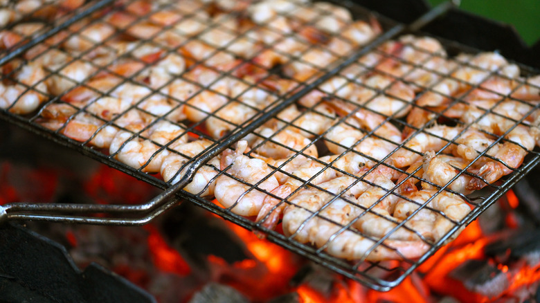 shrimp in grill basket on barbeque