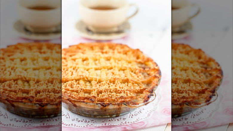 An apple pie in a glass pie dish