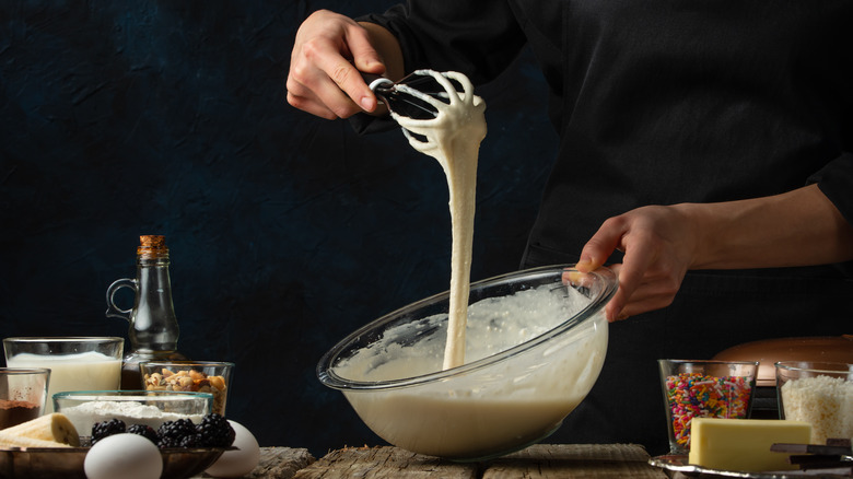 Person whisking batter in a bowl