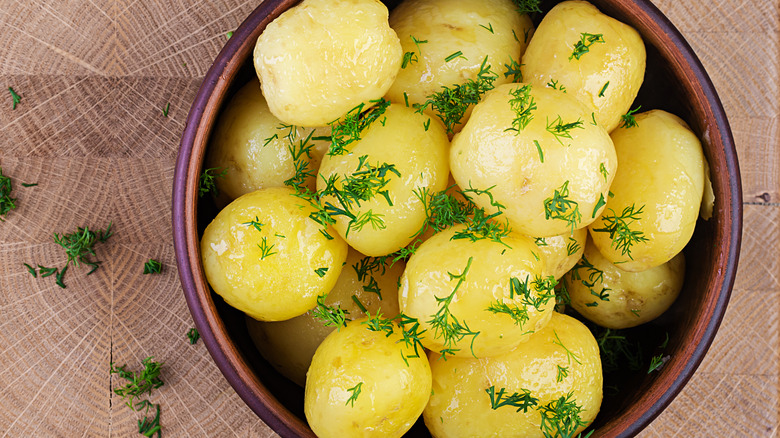 Boiled potatoes in a bowl with dill