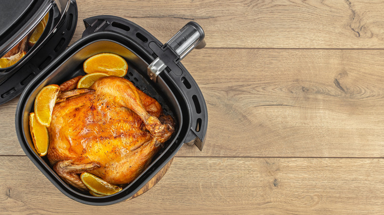 Roast chicken and orange wedges in air fryer