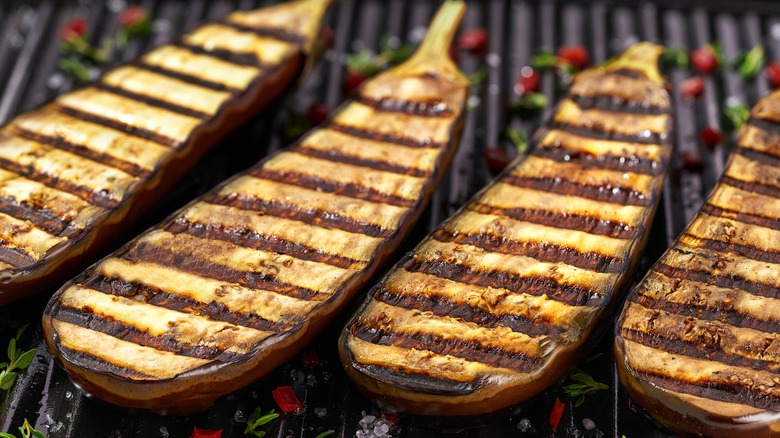 Eggplant slices on grill with char marks