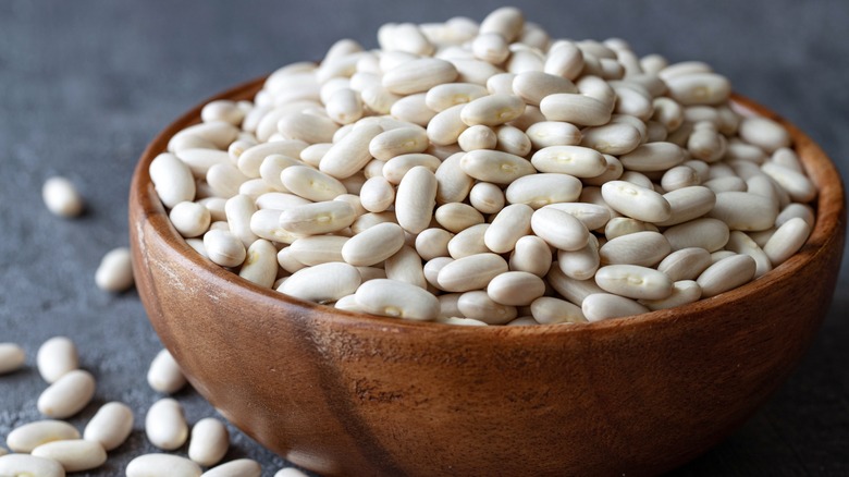 Brown bowl full of white beans