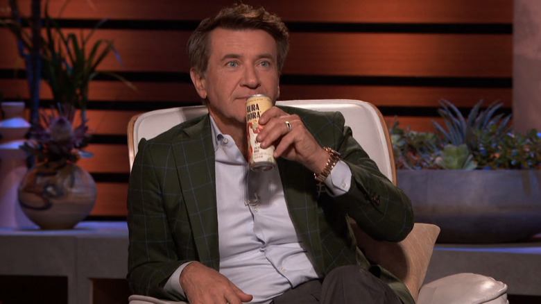 Robert Herjavec drinking Aura Bora