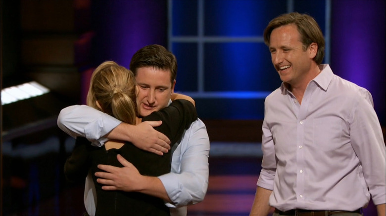Brian and Kevin Fleming hugging Lori Greiner on "Shark Tank"
