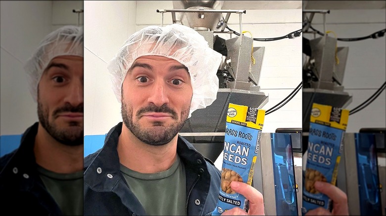 Brass Roots owner holding seeds