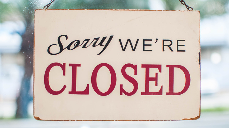 "Sorry We're Closed" sign.