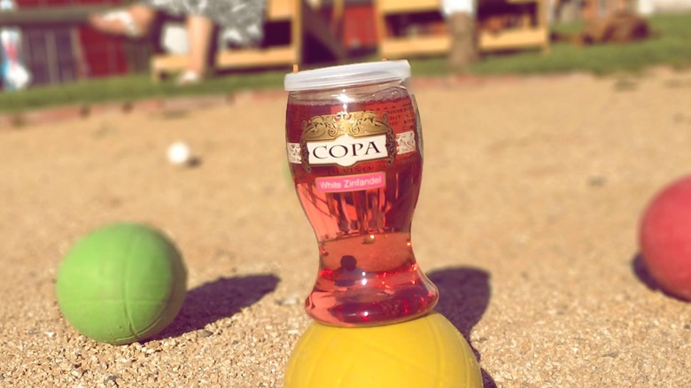 Copa di vino bottle balancing on ball