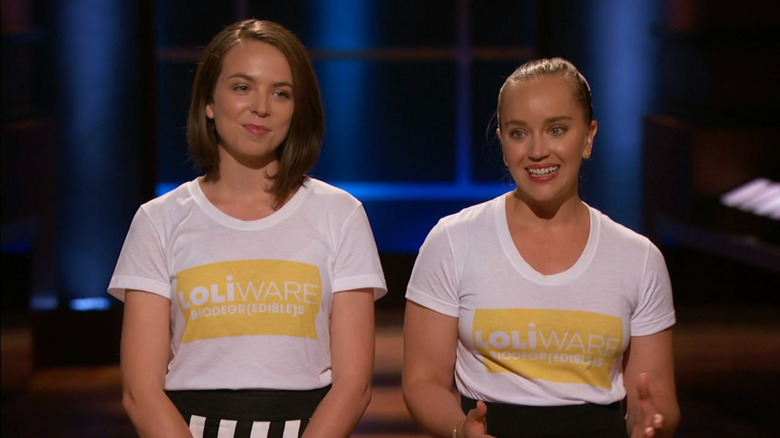 Loliware co-founders Leigh Ann Tucker (brown hair) and Chelsea Briganti (blonde hair) wearing white t-shirts with a yellow logo reading "Loliware Biodegr(edible)s"