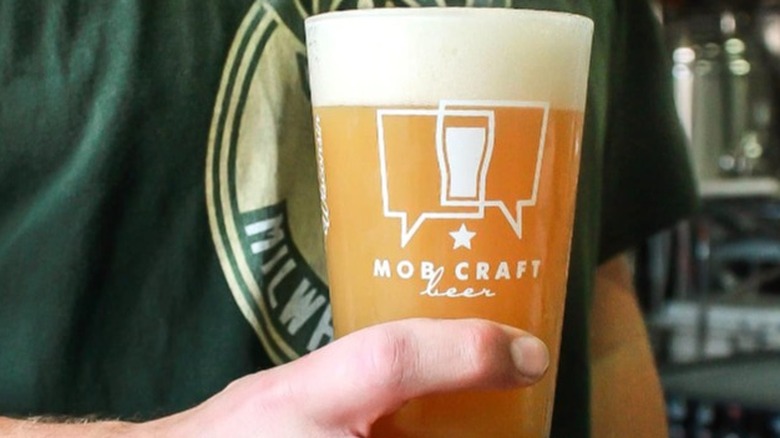 man holding glass of Beer