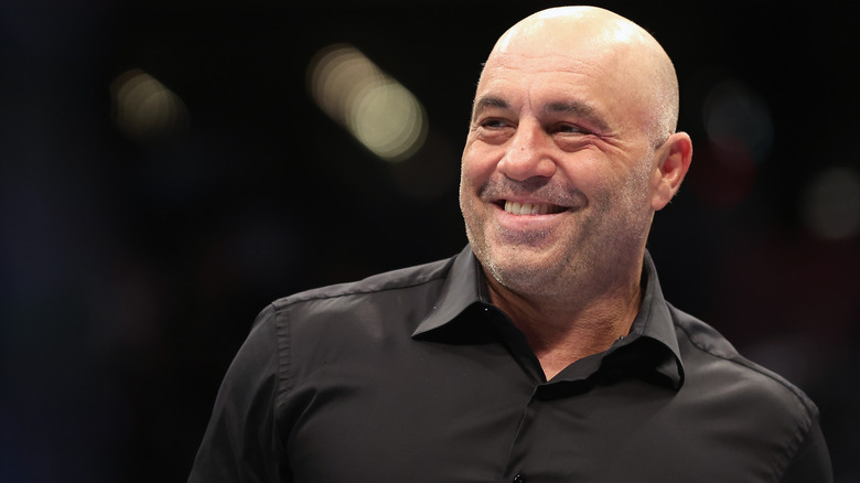 Joe Rogan smiling and looking to side
