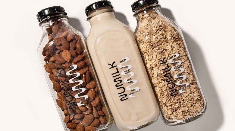 Three glass jars of Numilk