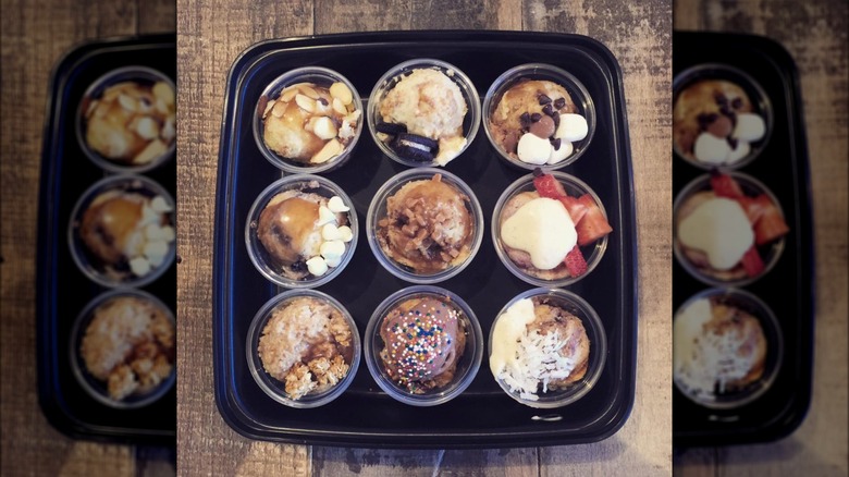 a tray of plastic cups of bread pudding