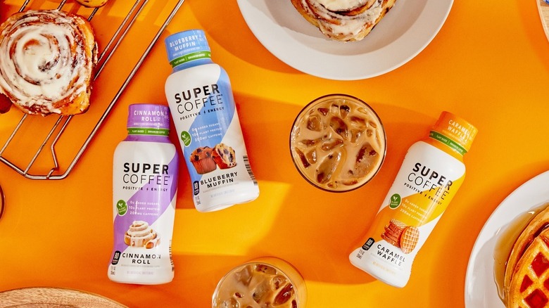 Super Coffee products with cinnamon rolls, muffins, and waffles