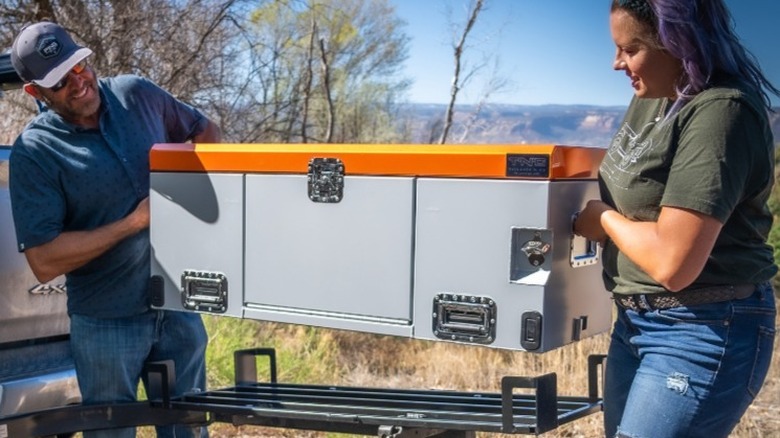 Tailgate N Go founders holding one of their products