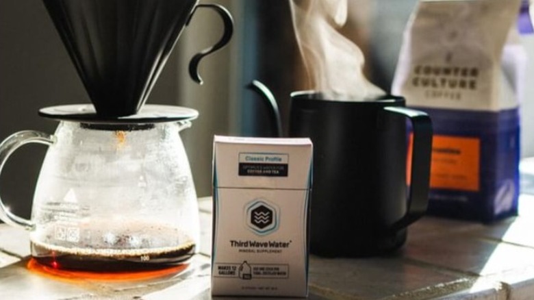 packet of Third Wave Water with coffee pot and cup