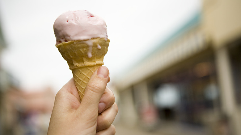 ice cream cone in hand