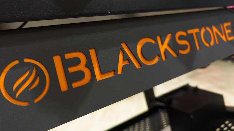 Blackstone griddle brand name in orange on black.